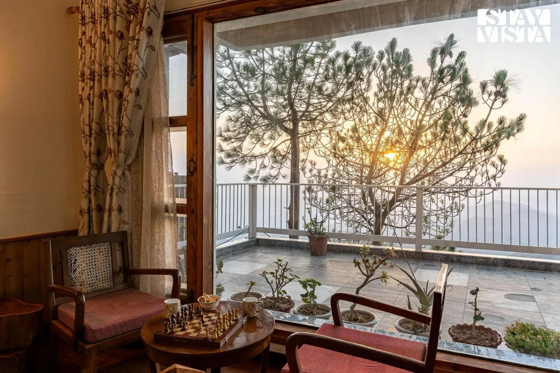 Balcony/Terrace in StayVista at The Rustic Retreat - 4BHK Valley View villa with Lawn, Bonfire