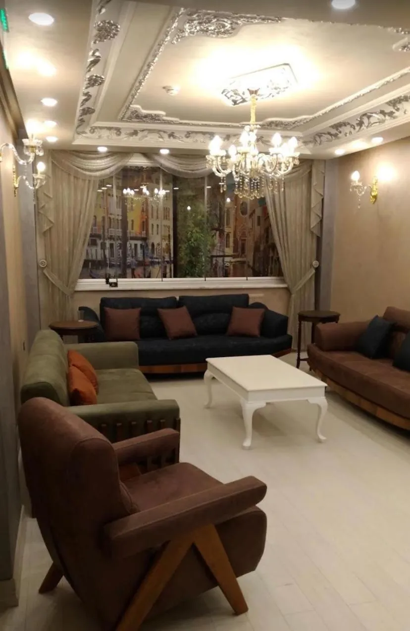 Communal lounge/ TV room in Linfer Otel