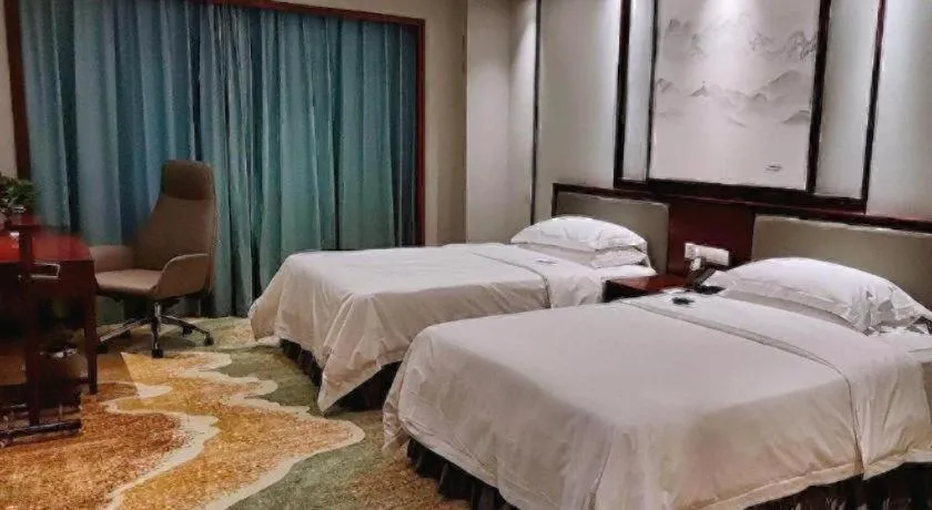 Bed in Yiyang Huatian Hotel