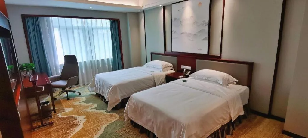 Bed in Yiyang Huatian Hotel