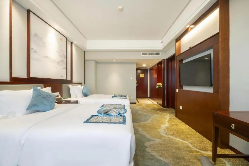 Bed in Yiyang Huatian Hotel