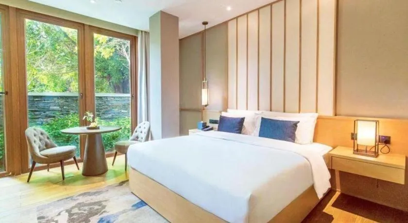 Bed in The Mulian Urban Resort Hotels Huadu