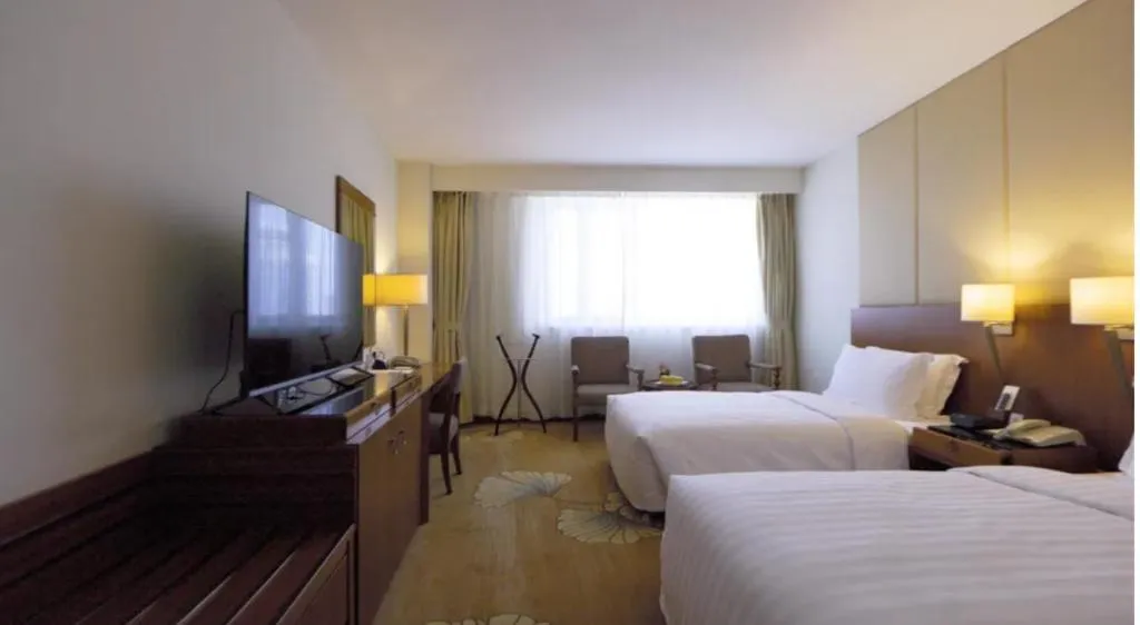 Bed in Jianguo Garden Hotel