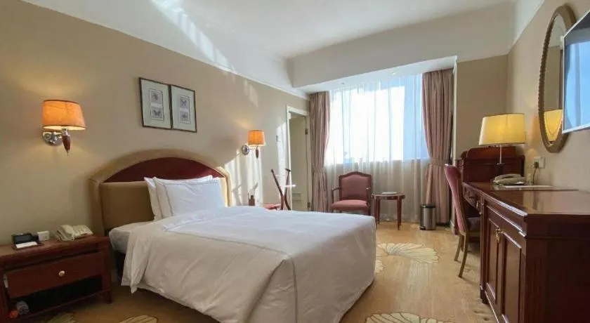 Bed in Jianguo Garden Hotel