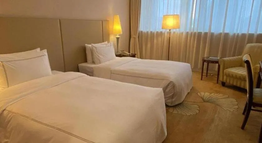 Bed in Jianguo Garden Hotel