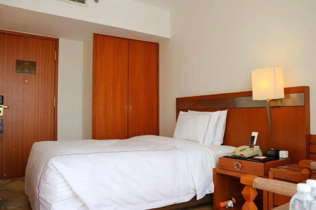 Bed in Jianguo Garden Hotel