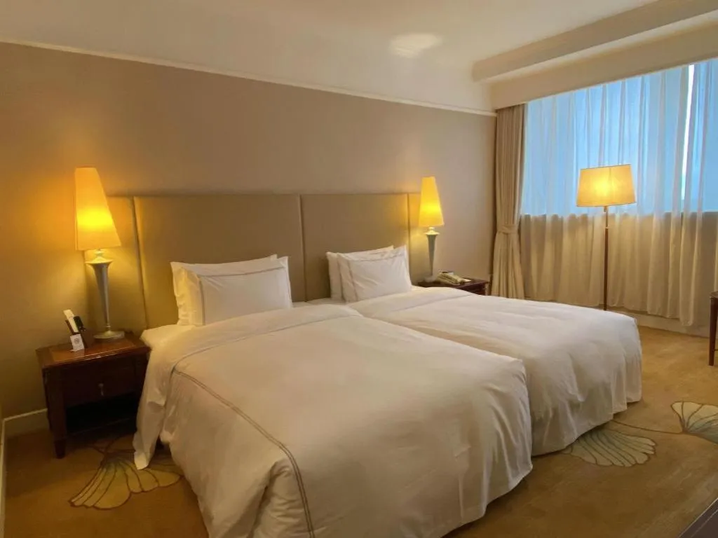 Bed in Jianguo Garden Hotel