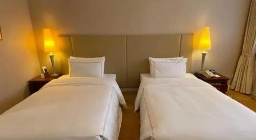Bed in Jianguo Garden Hotel