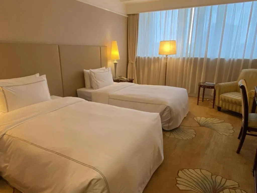 Bed in Jianguo Garden Hotel