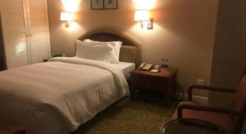 Bed in Jianguo Garden Hotel