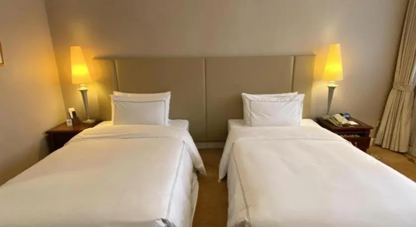 Bed in Jianguo Garden Hotel