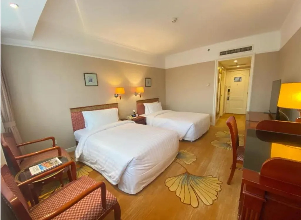 Bed in Jianguo Garden Hotel