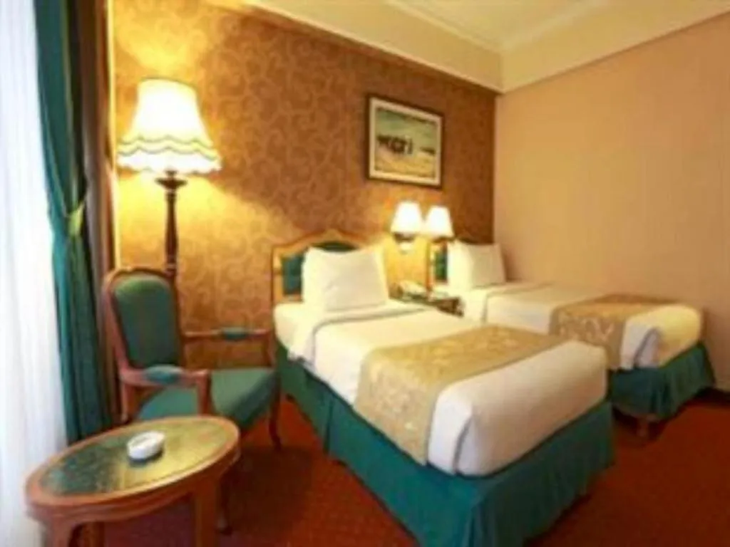 Bed in Gajahmada Graha Hotel