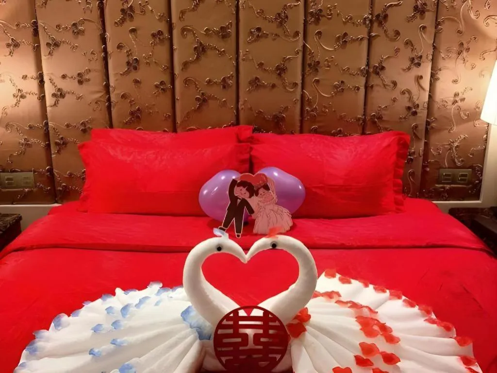 Bed in Yihe Grand Hotel