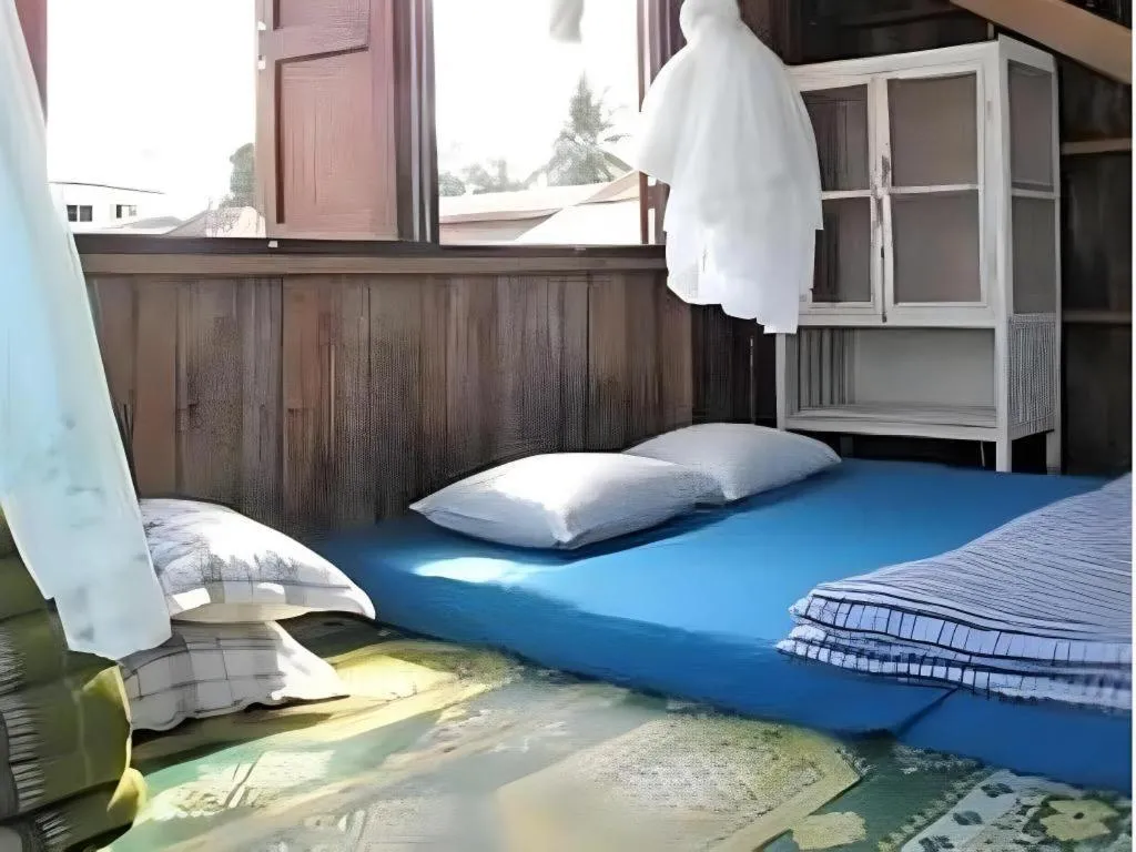 Bed in Baan ChanKhiang at ChiangKhan