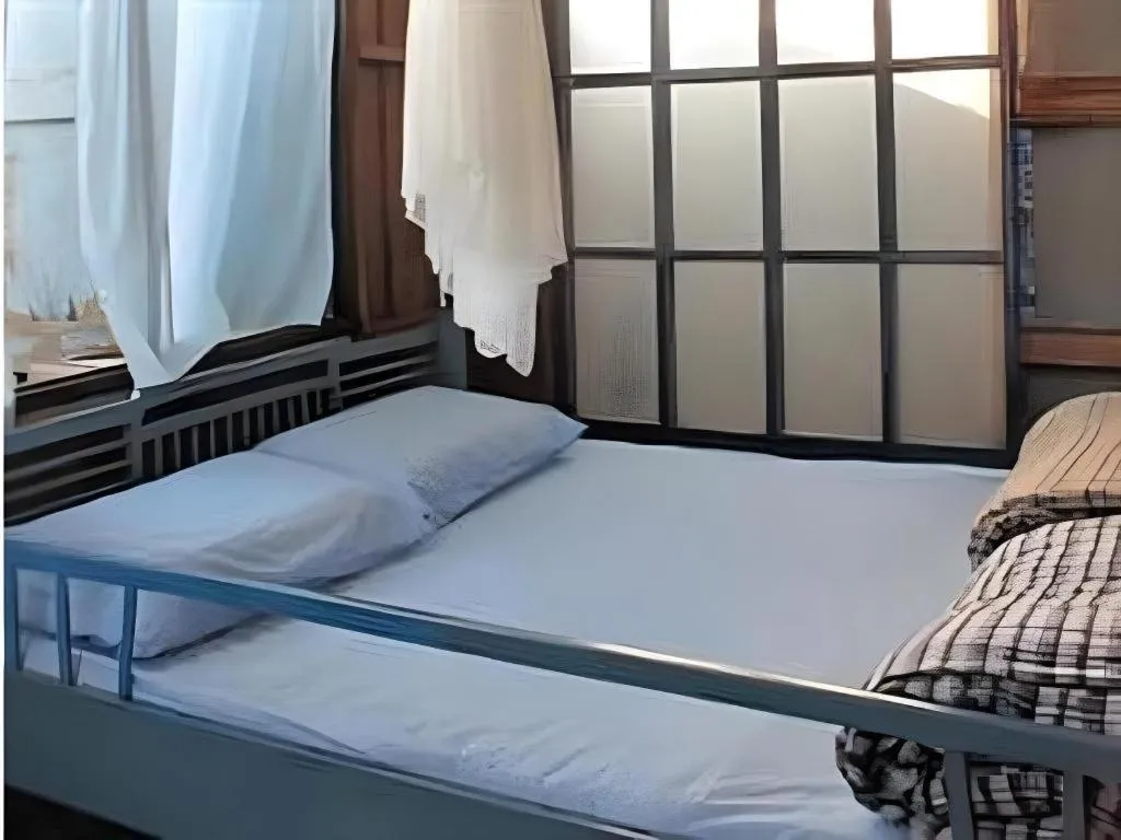 Bed in Baan ChanKhiang at ChiangKhan