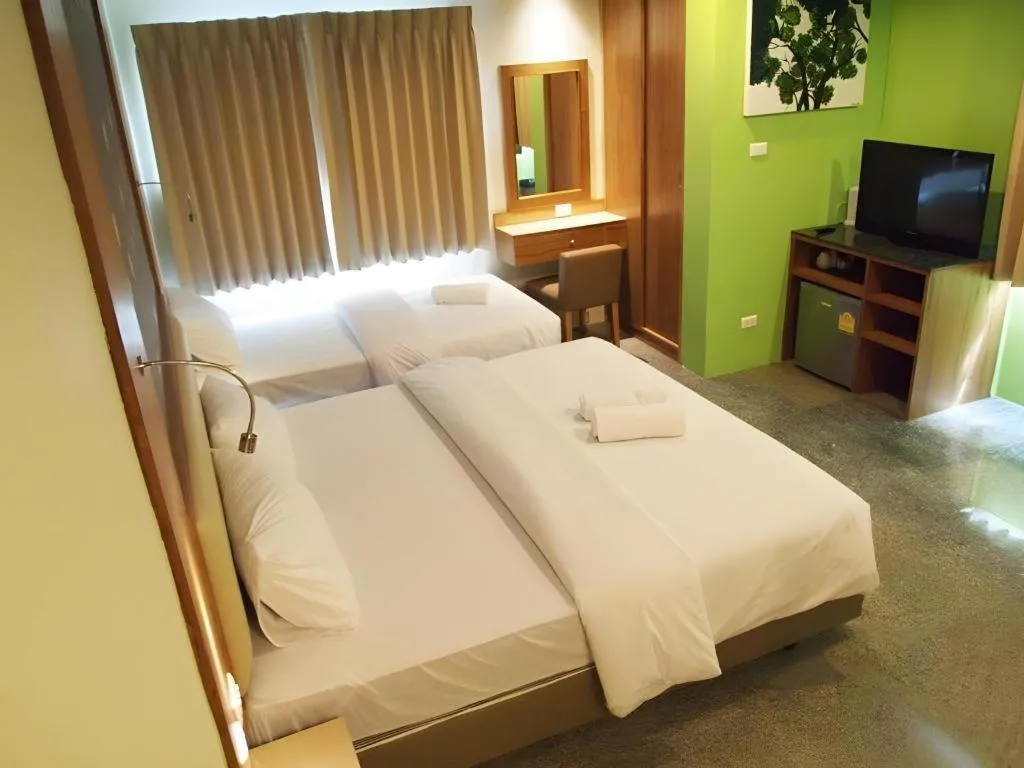 Bed in Phuket Ecozy Hotel