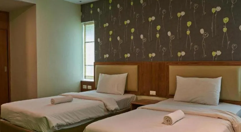 Bed in Phuket Ecozy Hotel