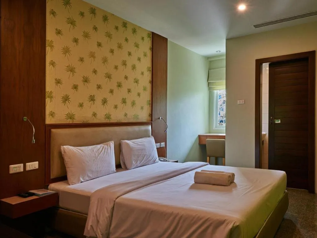 Bed in Phuket Ecozy Hotel