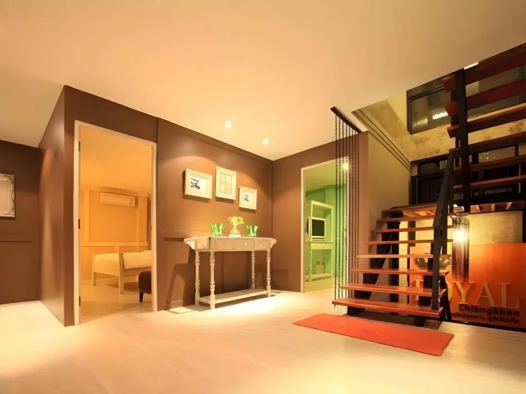 Bed in The Royal Chiangkhan Boutique Hotel