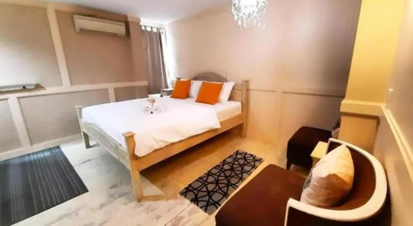 Bed in The Royal Chiangkhan Boutique Hotel