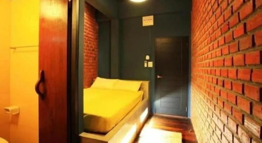 Bed in The Royal Chiangkhan Boutique Hotel