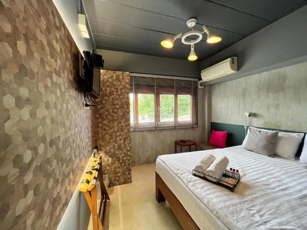 Bed in Chic Chiangkhan Hotel