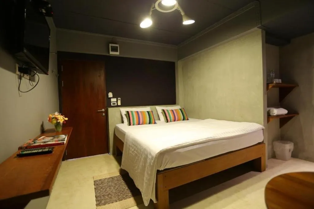 Bed in Chic Chiangkhan Hotel