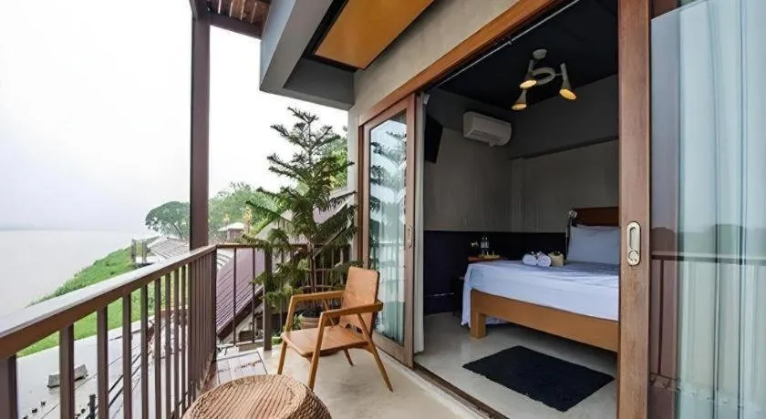 Bed in Chic Chiangkhan Hotel