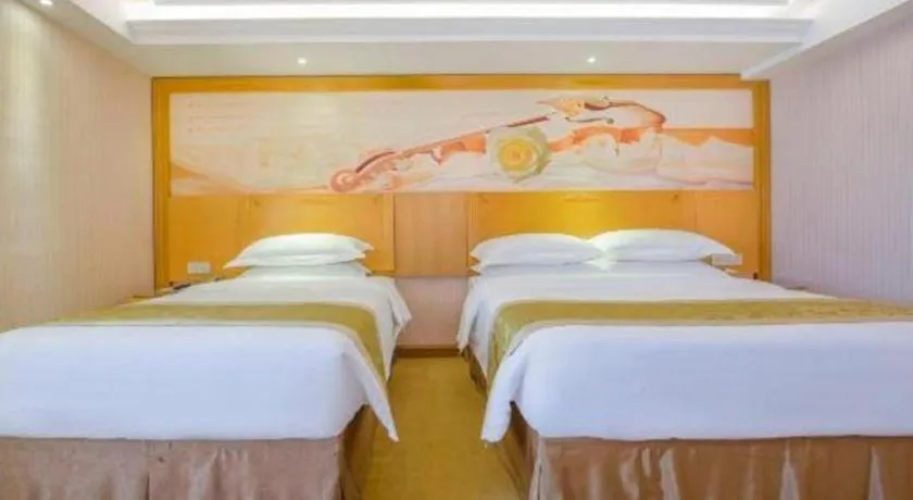 Bed in Vienna Hotel Guangzhou Panyu Shiqiao Center Branch