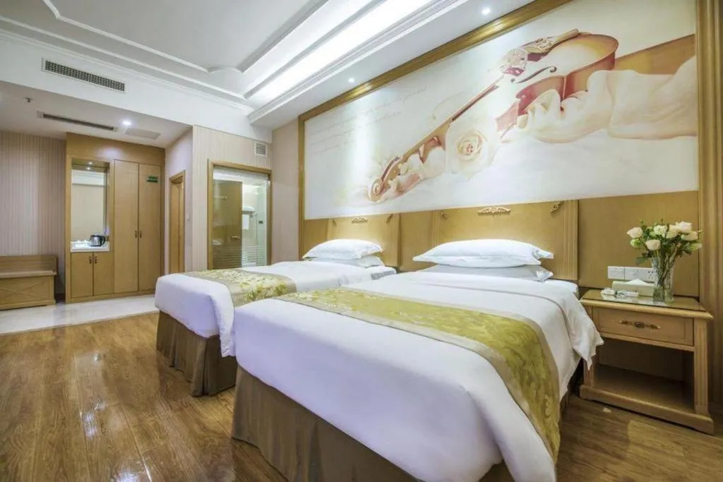 Bed in Vienna Hotel Guangzhou Panyu Shiqiao Center Branch