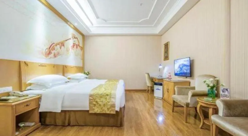 Bed in Vienna Hotel Guangzhou Panyu Shiqiao Center Branch