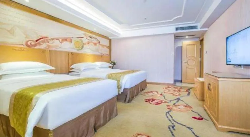Bed in Vienna Hotel Guangzhou Panyu Shiqiao Center Branch