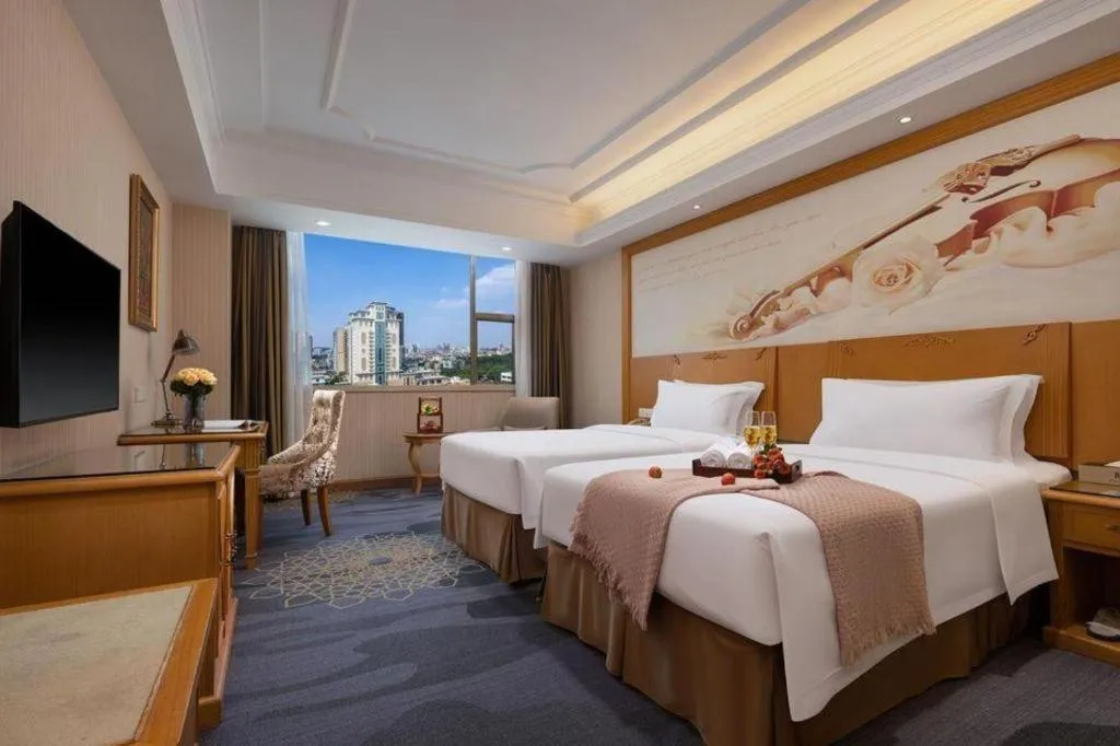 Bed in Vienna Hotel Guangzhou Panyu Shiqiao Center Branch