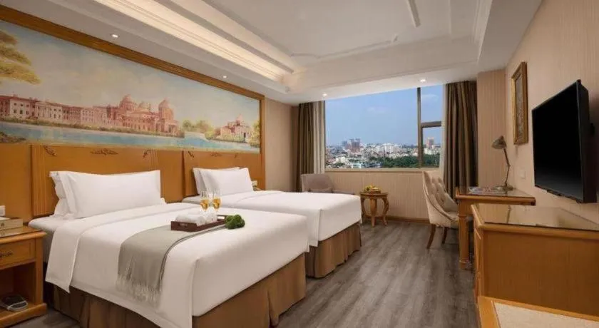Bed in Vienna Hotel Guangzhou Panyu Shiqiao Center Branch