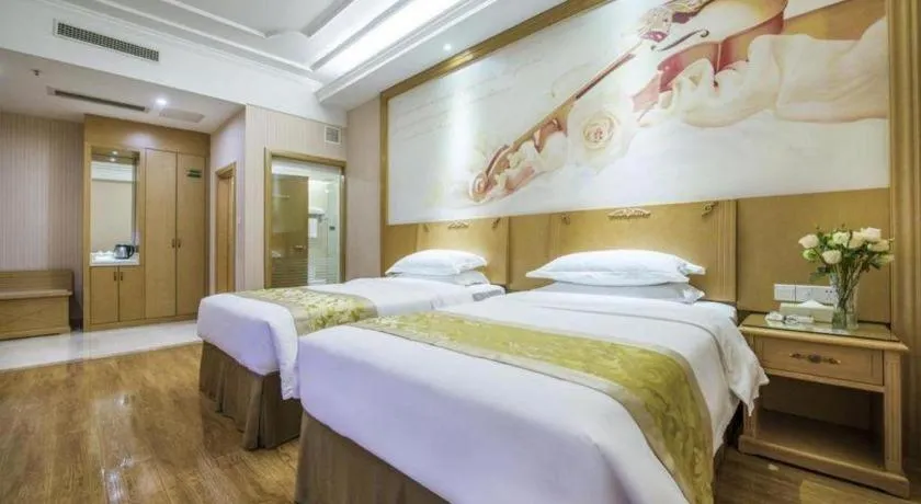 Bed in Vienna Hotel Guangzhou Panyu Shiqiao Center Branch
