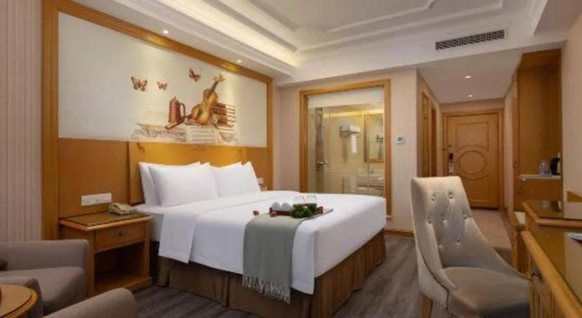 Bed in Vienna Hotel Guangzhou Panyu Shiqiao Center Branch