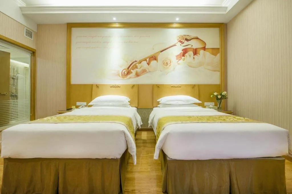 Bed in Vienna Hotel Guangzhou Panyu Shiqiao Center Branch