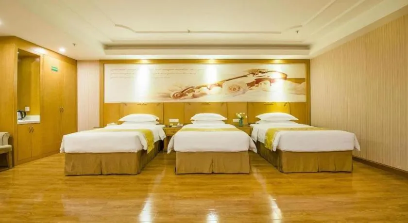Bed in Vienna Hotel Guangzhou Panyu Shiqiao Center Branch