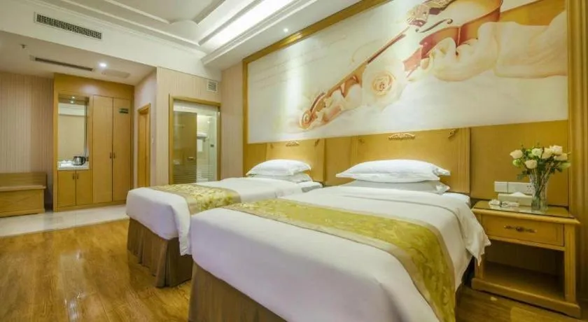 Bed in Vienna Hotel Guangzhou Panyu Shiqiao Center Branch