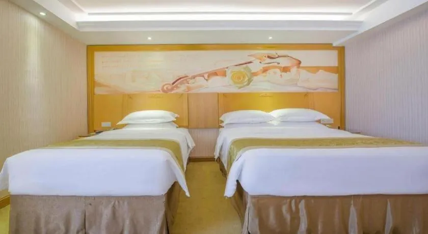 Bed in Vienna Hotel Guangzhou Panyu Shiqiao Center Branch