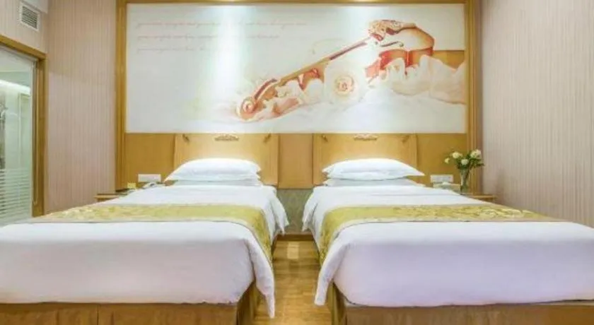Bed in Vienna Hotel Guangzhou Panyu Shiqiao Center Branch