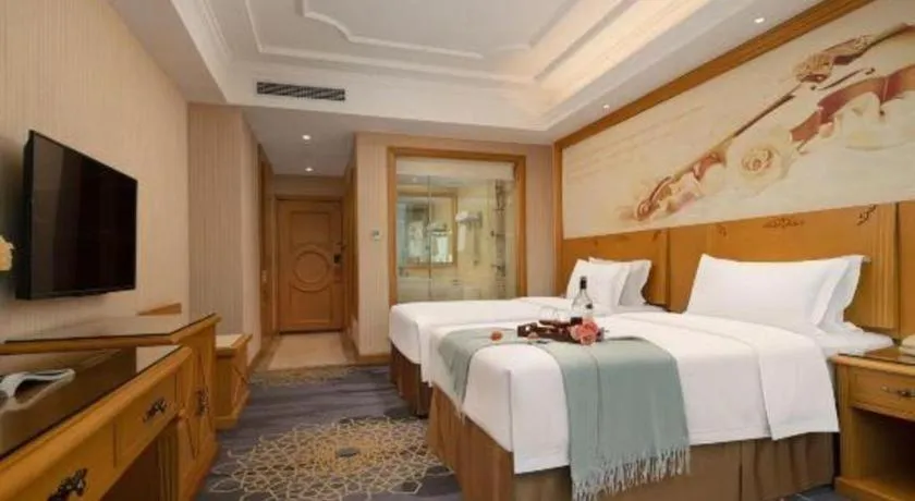 Bed in Vienna Hotel Guangzhou Panyu Shiqiao Center Branch