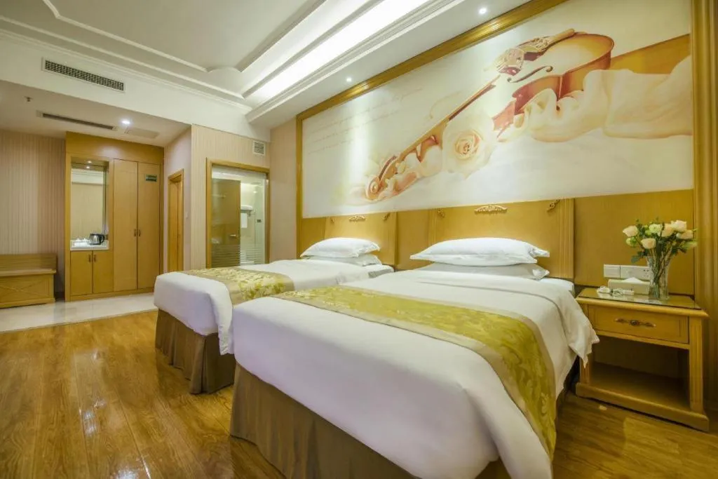 Bed in Vienna Hotel Guangzhou Panyu Shiqiao Center Branch