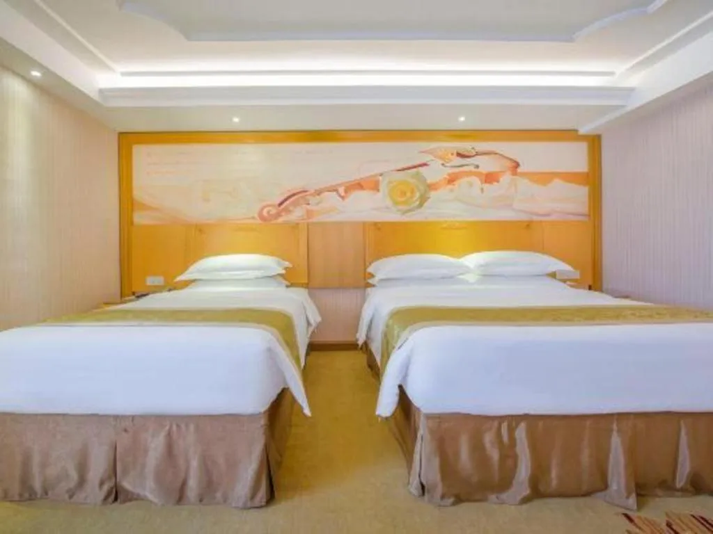 Bed in Vienna Hotel Guangzhou Panyu Shiqiao Center Branch