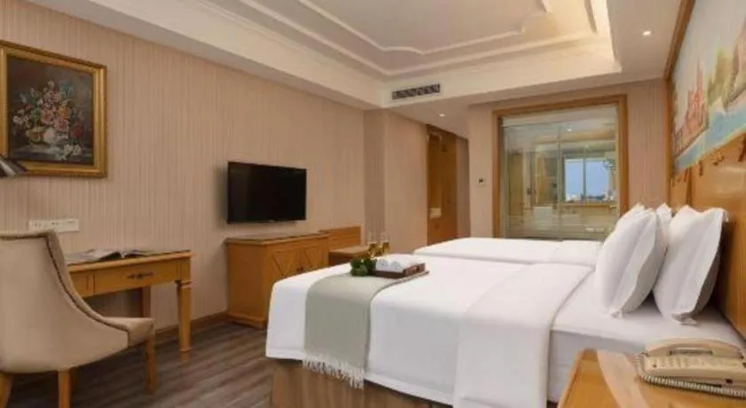 Bed in Vienna Hotel Guangzhou Panyu Shiqiao Center Branch