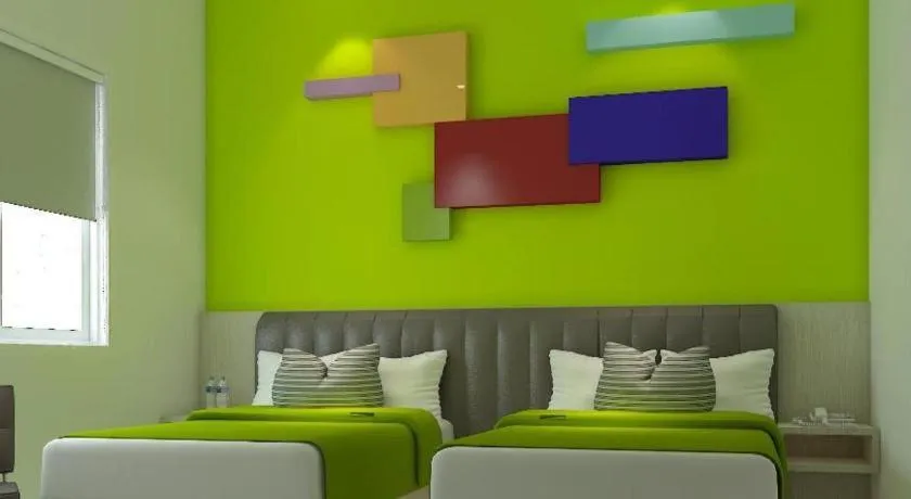 Bed in Zoom Dharmahusada Hotel