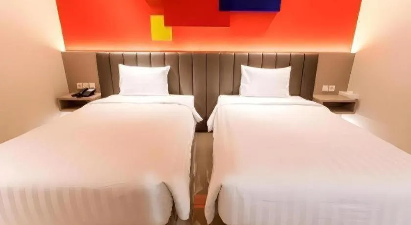 Bed in Zoom Dharmahusada Hotel