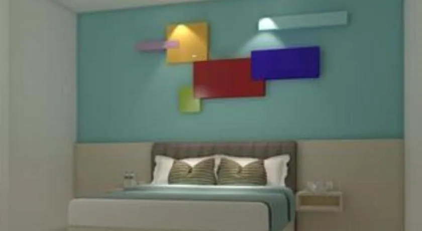 Bed in Zoom Dharmahusada Hotel