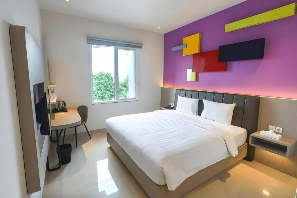 Bed in Zoom Dharmahusada Hotel